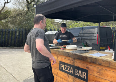 Happy customer waiting for his pizza