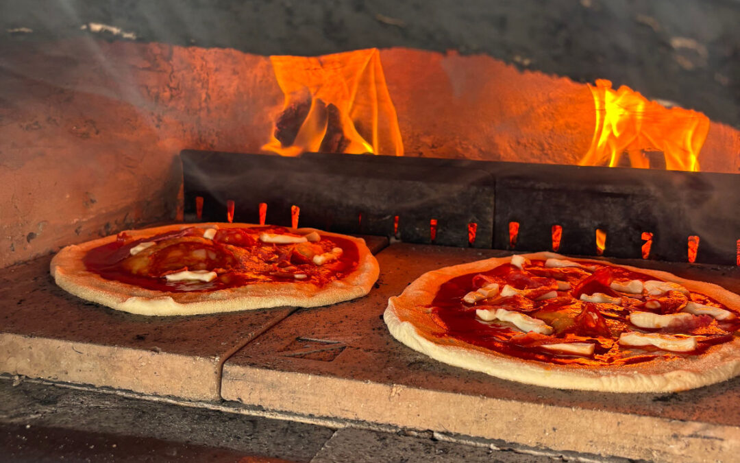 Woodfired pizzas cooking